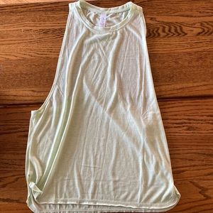 Two tanks. Ones a light green, the other is white. Both medium